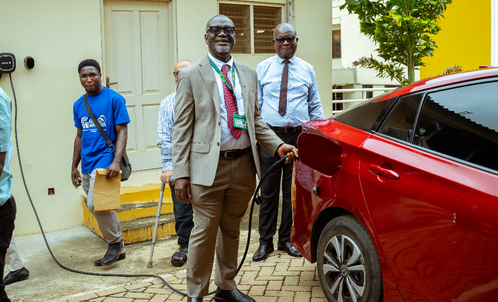 The Provost of the College of Engineering, Prof. Kwabena Biritwum Nyarko, charges an electric vehicle as part of the official commissioning