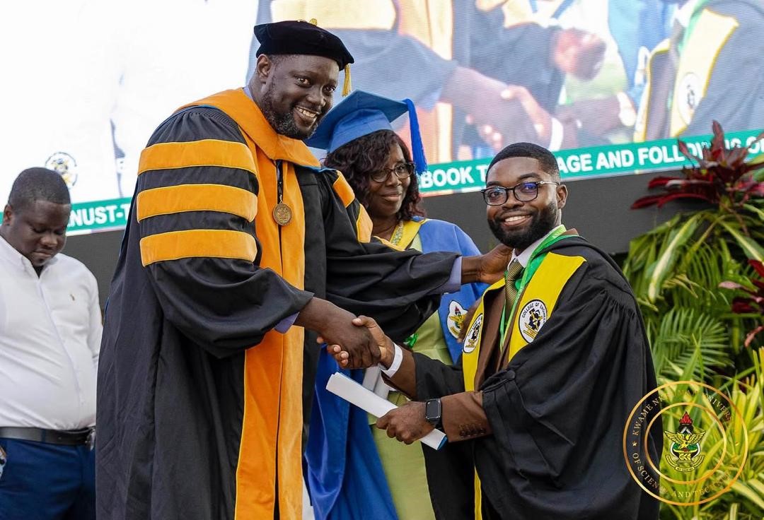 A graduand being congratulated