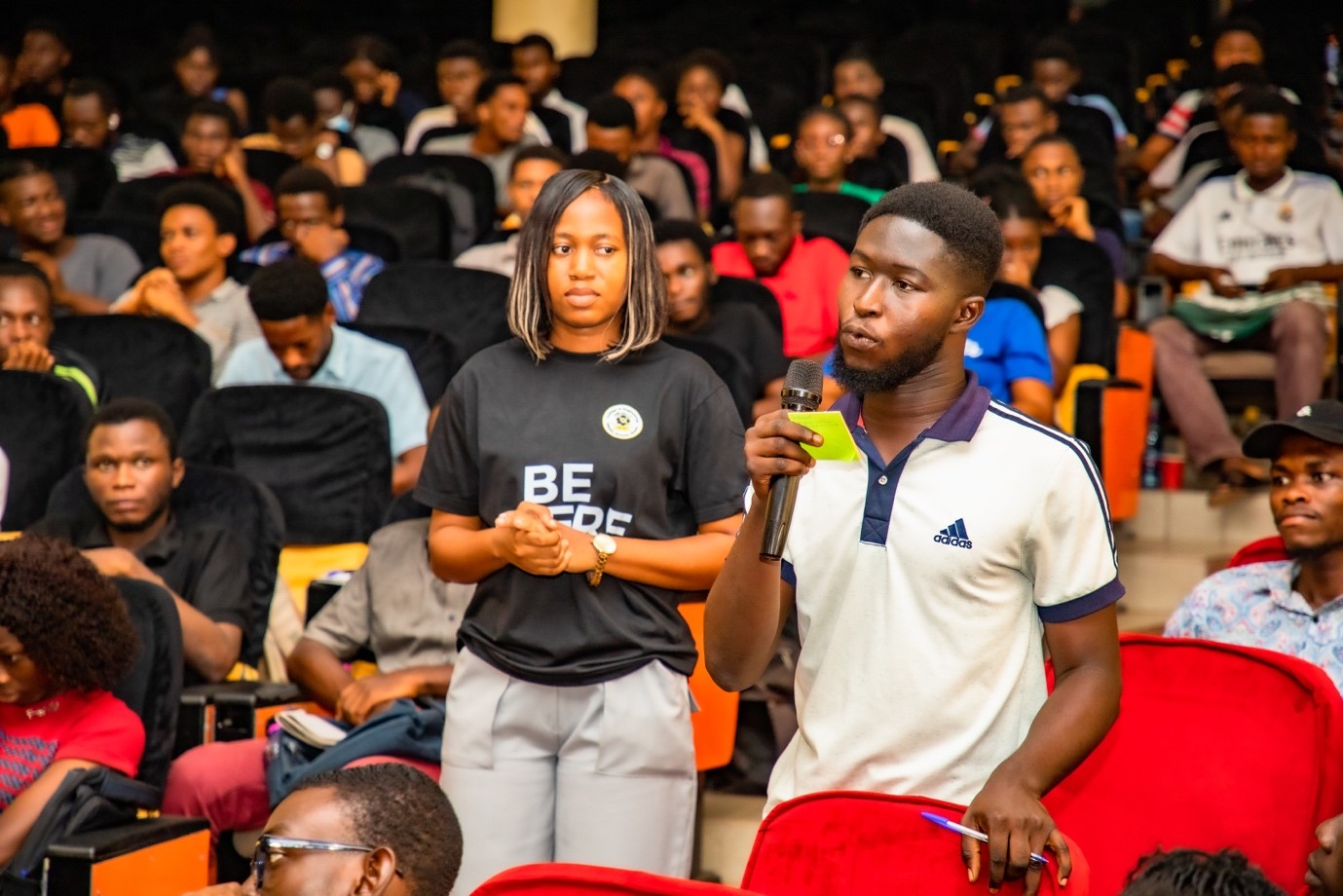 A student asking a question during the panel discussion