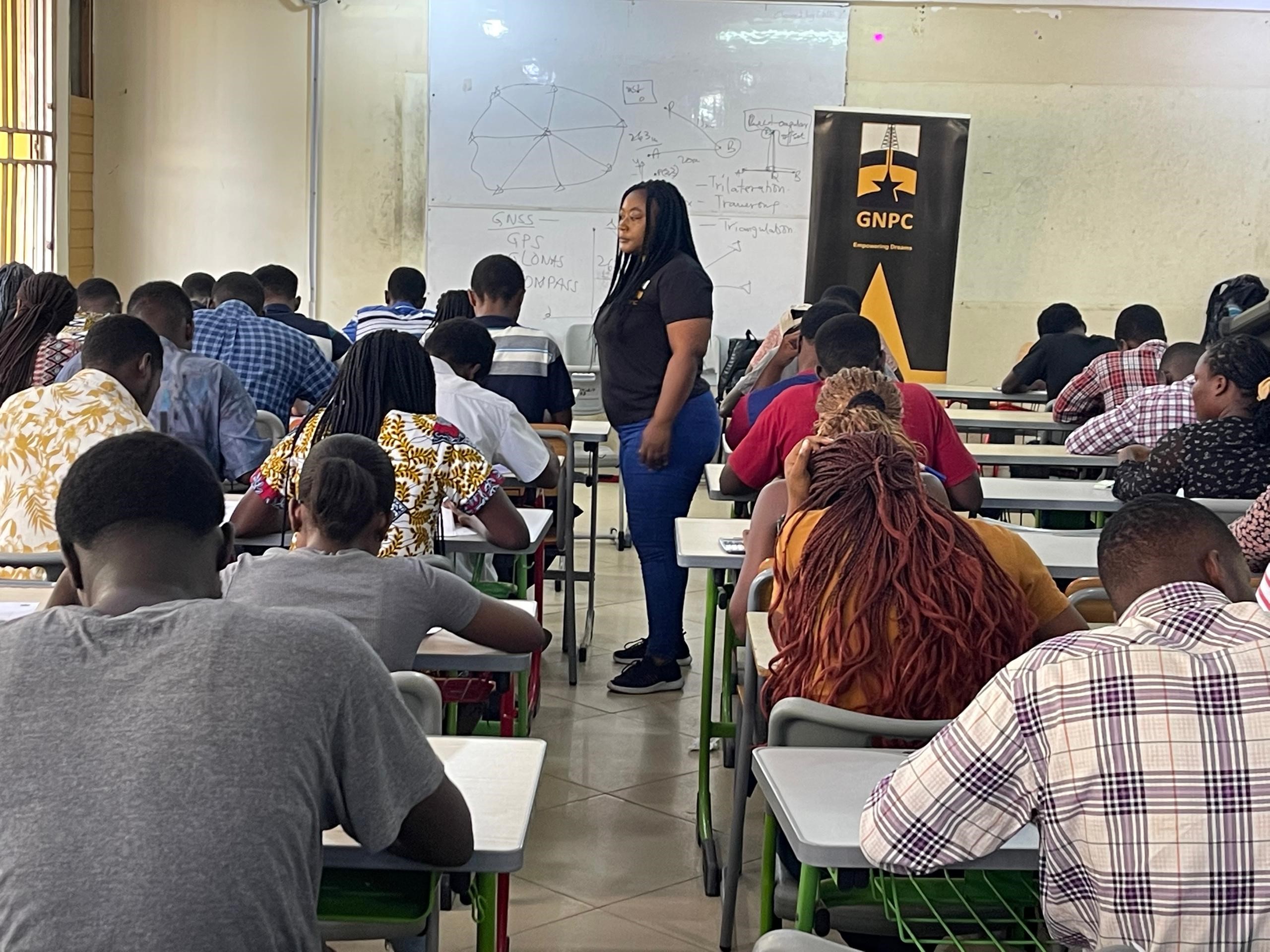 Photograph of students undertaking an aptitude test with GNPC