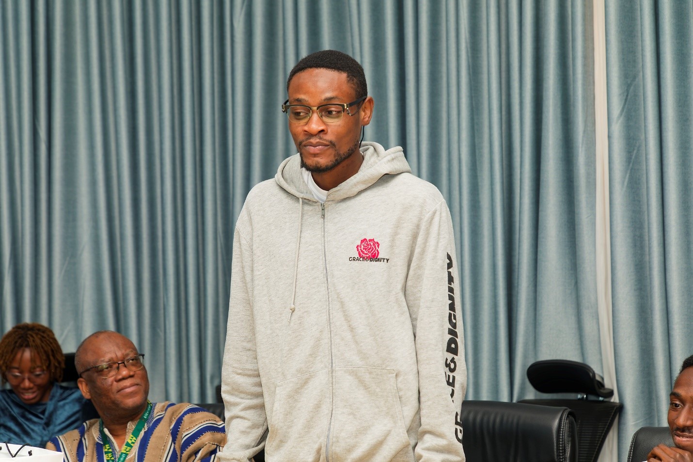 A student speaks on behalf of the class during the reflection and feedback session.