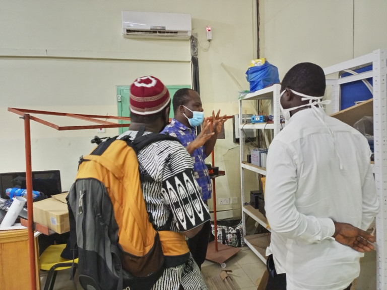 Dr. Richard Opoku, Lecturer at the Mechanical Engineering Department explaining some innovations in the solar laboratory.