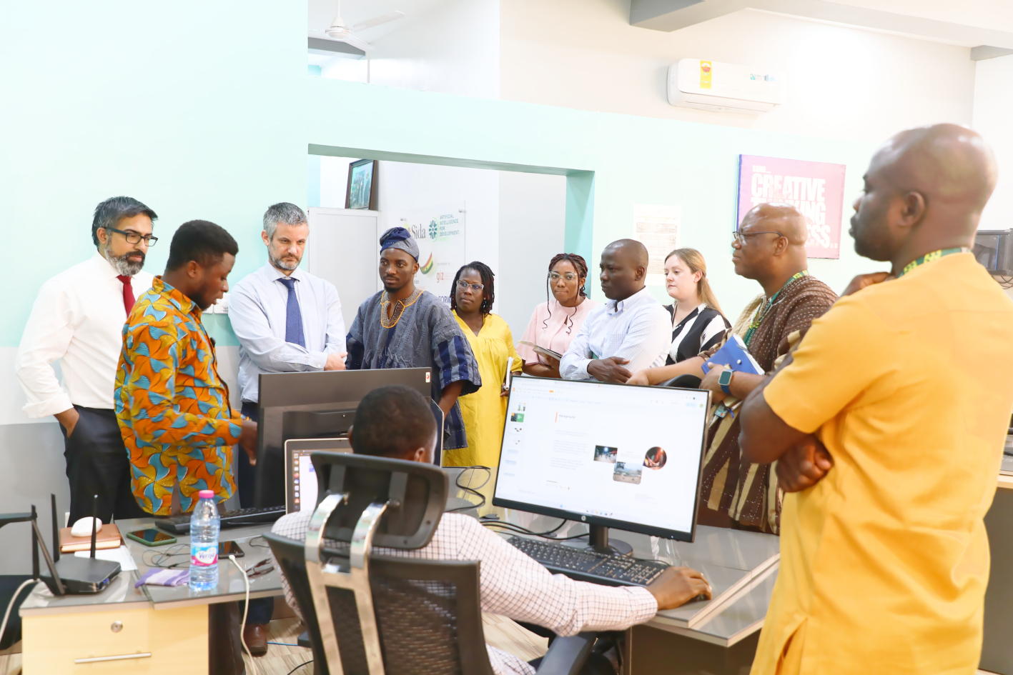 A RAIL research assistant explaining his research to the team