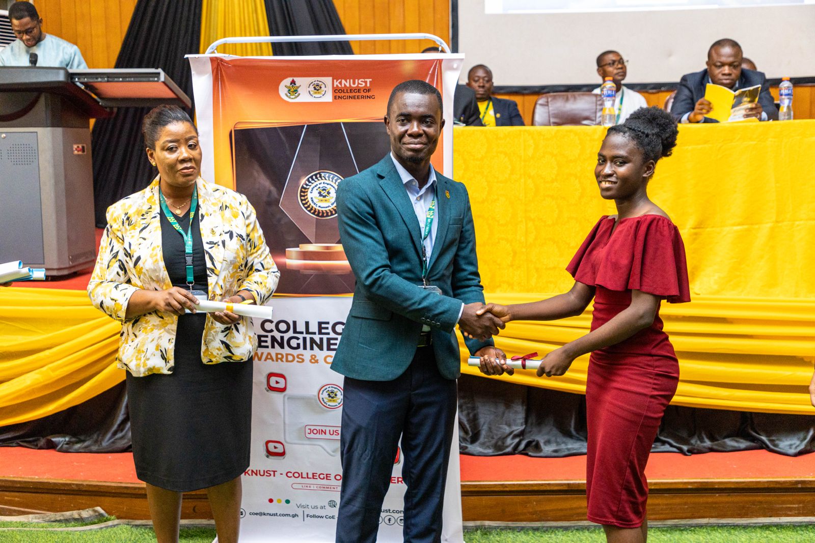 A Student receiving her congratulatory award from the Head of the Computer Engineering Department, Prof. Emmanuel Akowuah